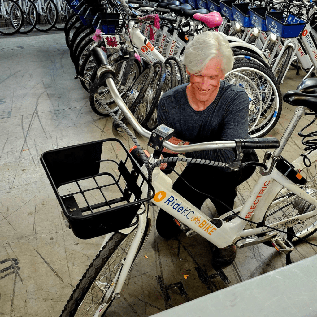 Volunteer Paul works on a bike