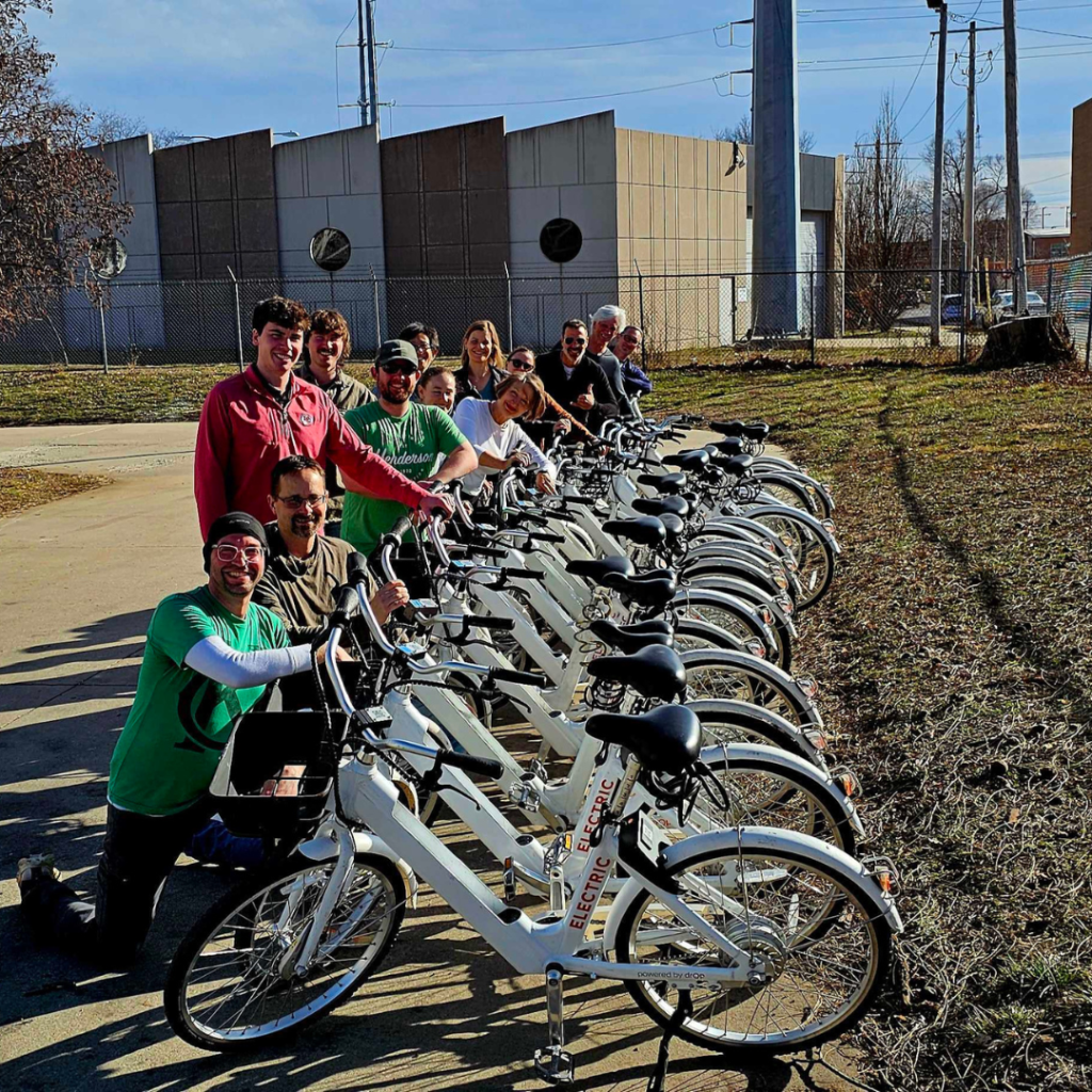 Volunteer group poses with freshly cleaned bikes